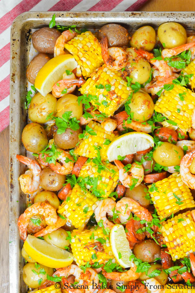 Shrimp, corn on the cob, baby potates, lemon with cajun seasoning on a sheet pan. Sheet Pan Dinner Options.