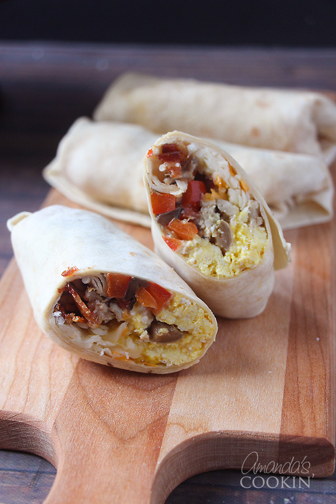 These simple and easy back to school breakfast ideas are perfect for busy lifestyles! This sliced burrito looks scrumptious with the egg, bacon and other veggies for the filling!